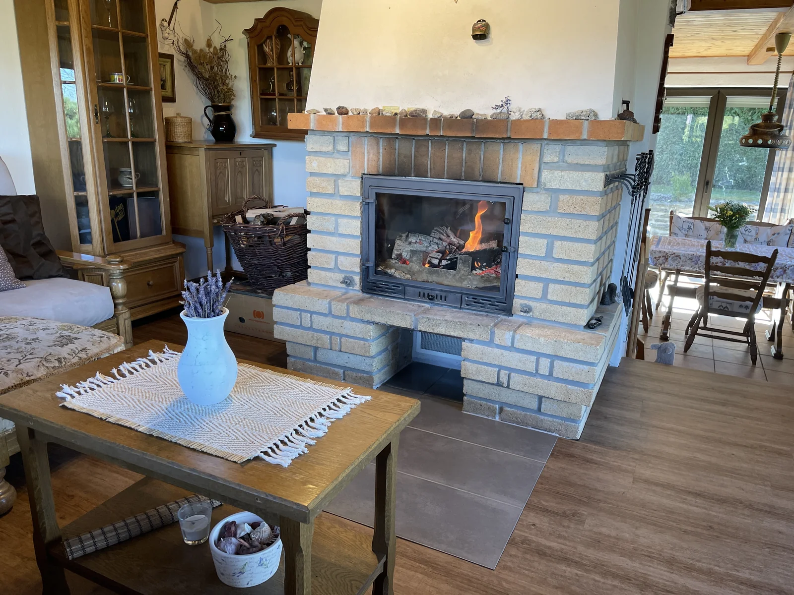 A fire burning in the stove in the cottage living room
