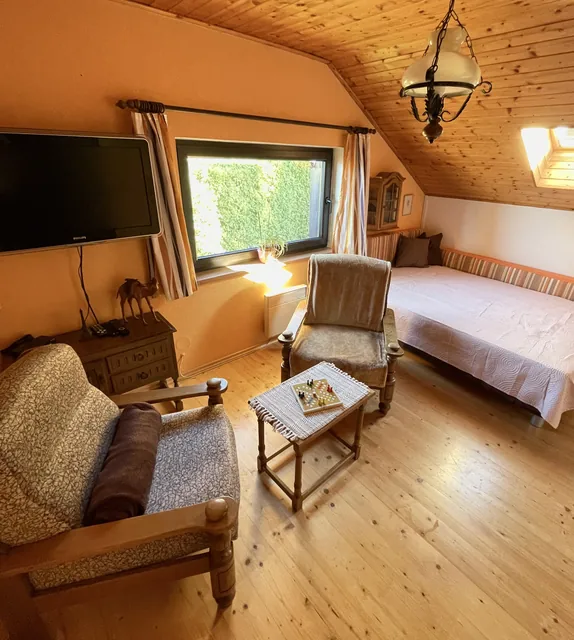 Attic room with seating