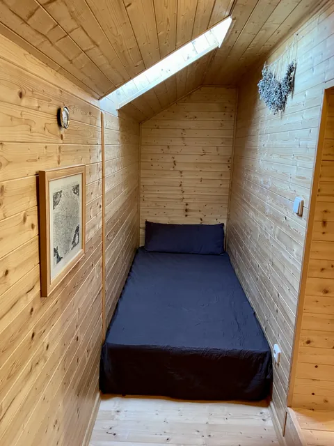 Attic room with an extra bed, accessed through the second upstairs bedroom